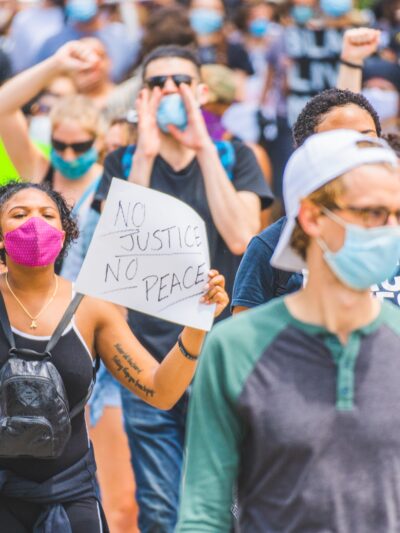 People marching in street protesting police violence