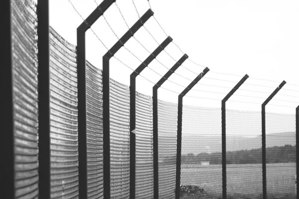 jail fence with barbed wire