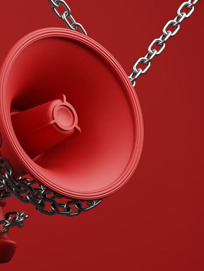 Chained bullhorn on red background