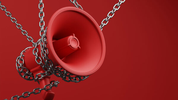 Chained bullhorn on red background
