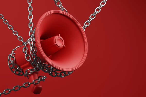Chained bullhorn on red background