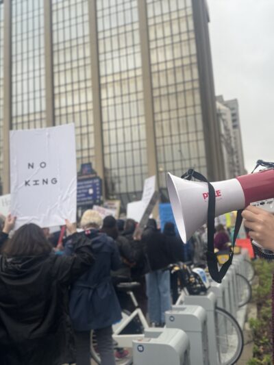 DeOnyae-Dior Valentina speaks into a megaphone at a protest.