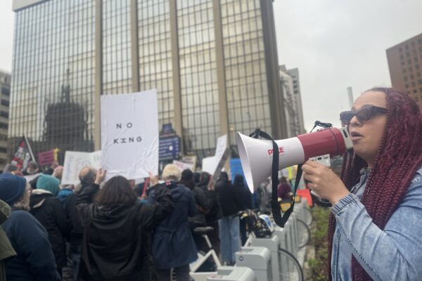 DeOnyae-Dior Valentina speaks into a megaphone at a protest.