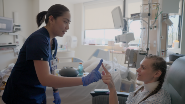 Isabel with a patient at her new job in the neuro ICU in New Jersey.
