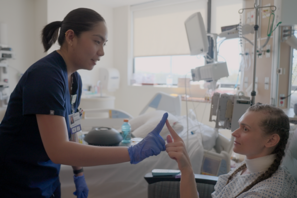 Isabel with a patient at her new job in the neuro ICU in New Jersey.
