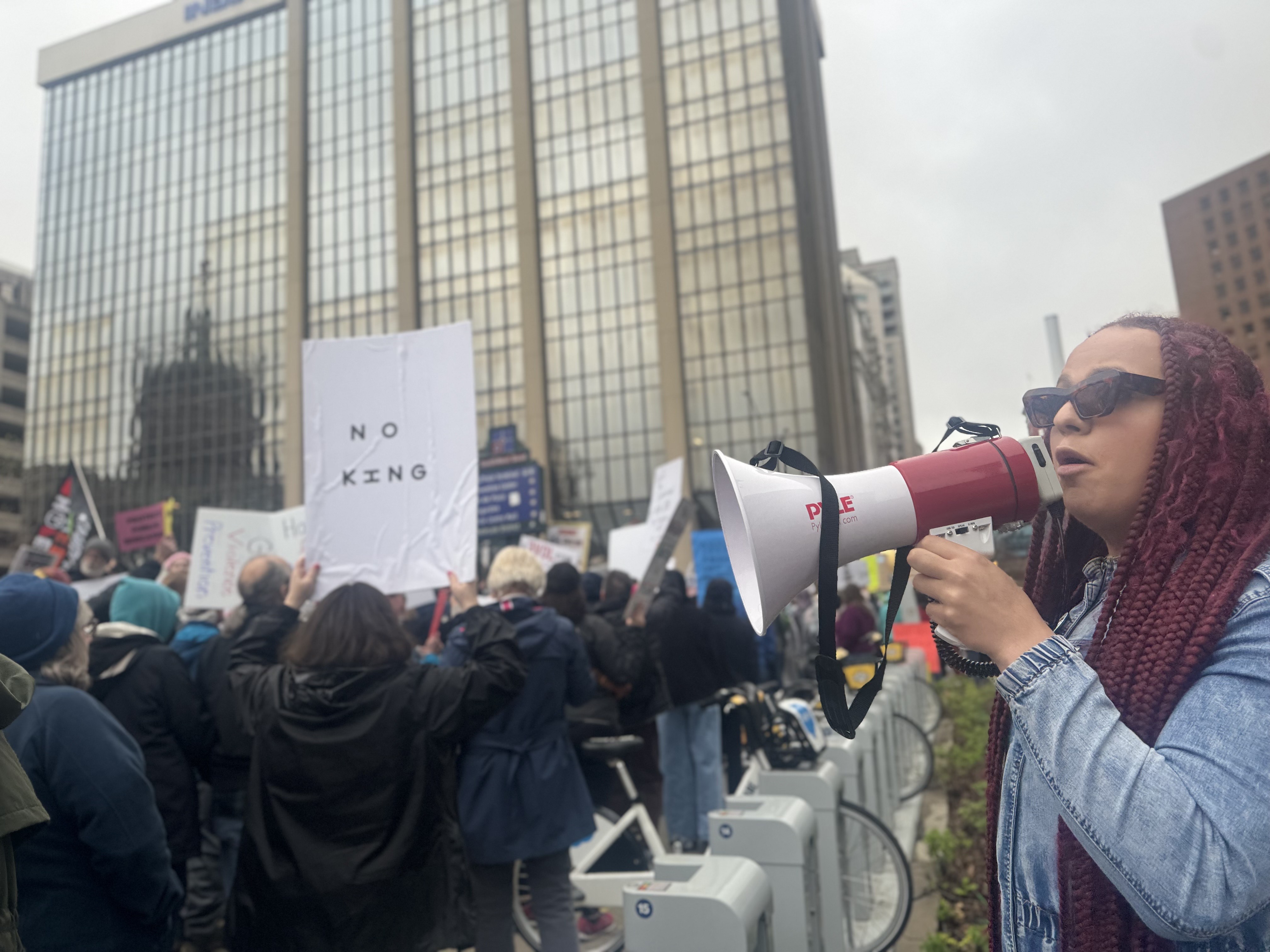 DeOnyae-Dior Valentina speaks into a megaphone at a protest.