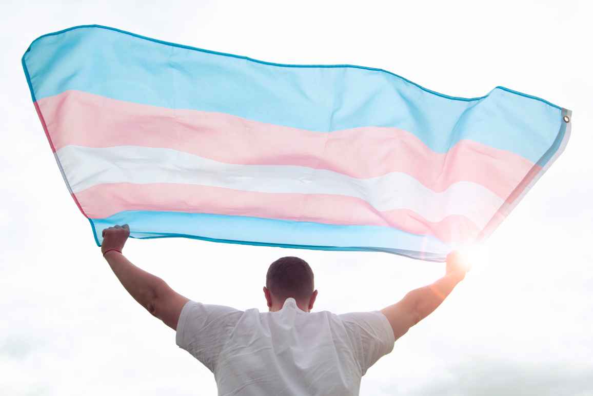 Person waving the transgender flag