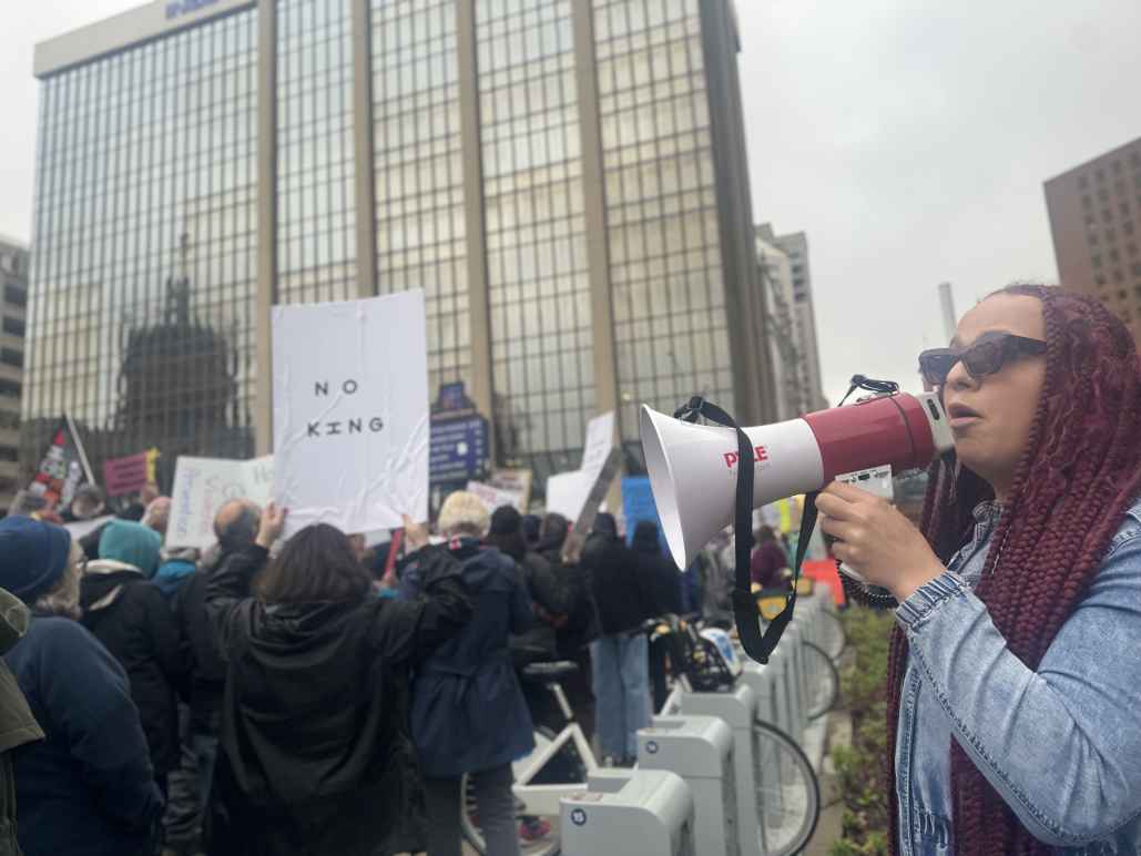 DeOnyae-Dior Valentina speaks into a megaphone at a protest.