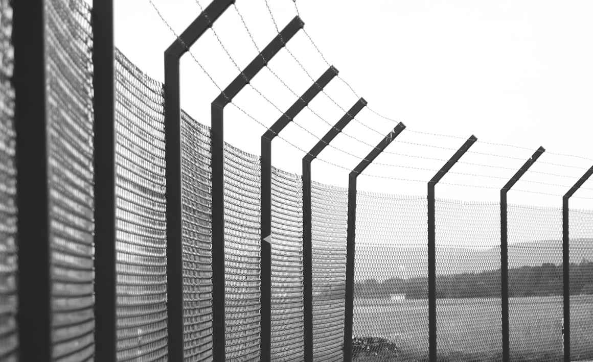 jail fence with barbed wire