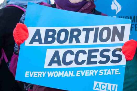 Rally sign that reads "Abortion Access" 
