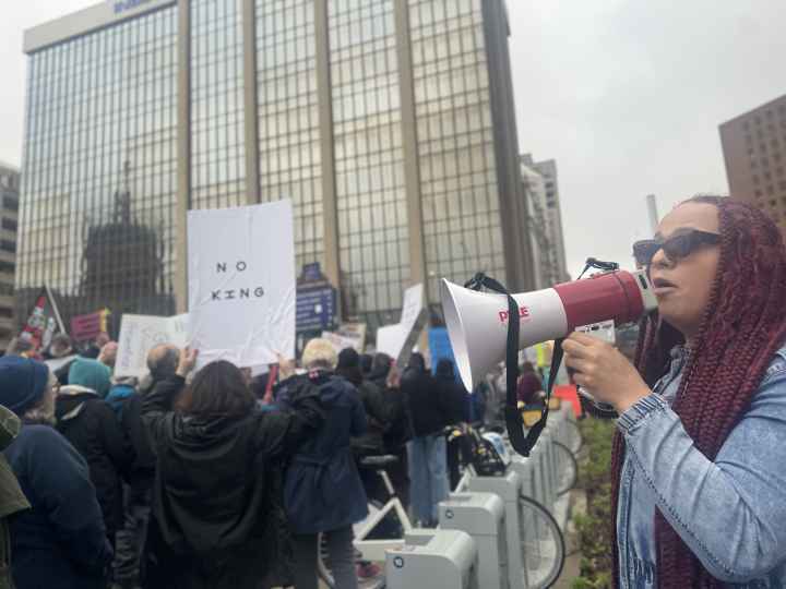 DeOnyae-Dior Valentina speaks into a megaphone at a protest.