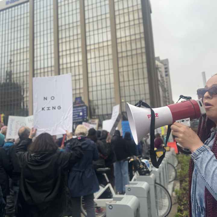 DeOnyae-Dior Valentina speaks into a megaphone at a protest.